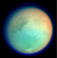 Titan composite image from Cassini. Logo for The Astrophysics Spectator.